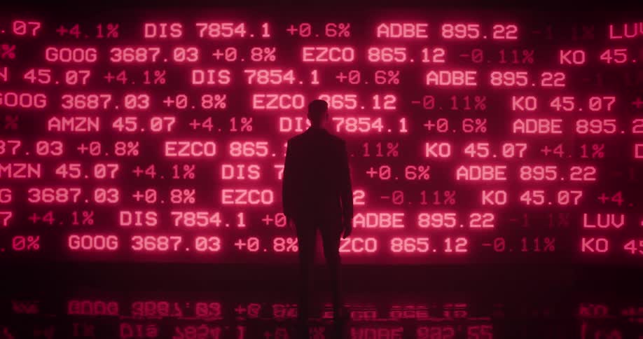 Silhouette of a man walking towards a wall filled with moving neon pink text