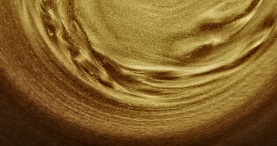 Gold sand flows and ripples in a whirlpool