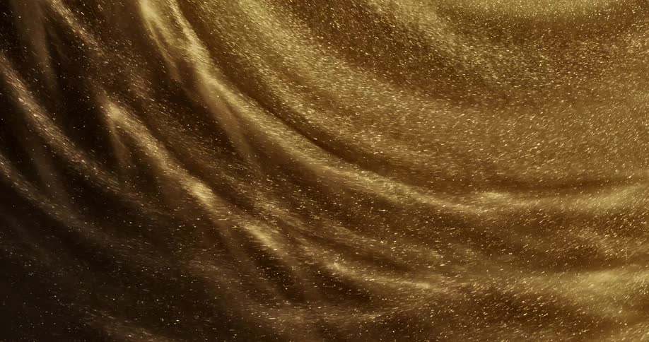 Golden glitter swirls round and round making for a beautiful scene