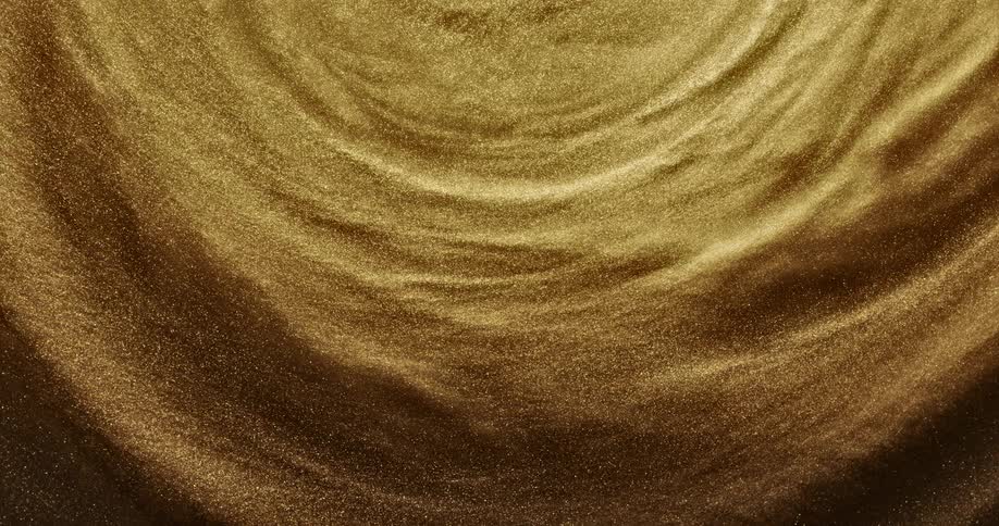 A circular tunnel of spinning shimmering gold grains