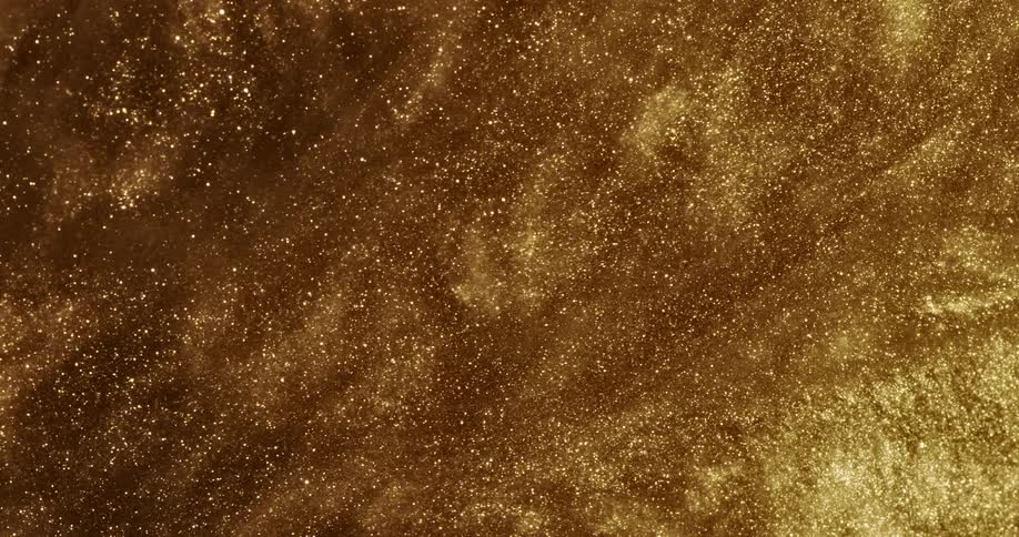 Bright shiny glittering gold ink slowly spinning in running waves and ripples
