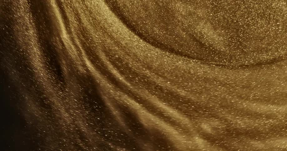Bright shiny glittering gold ink slowly spinning in concentric waves and ripples