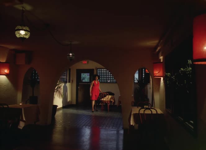 Woman walking into building