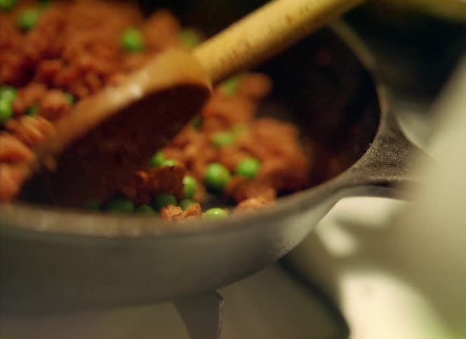 A person is cooking food on their oven