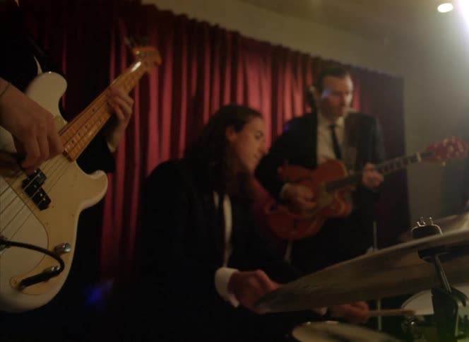 A group of people are playing instruments together