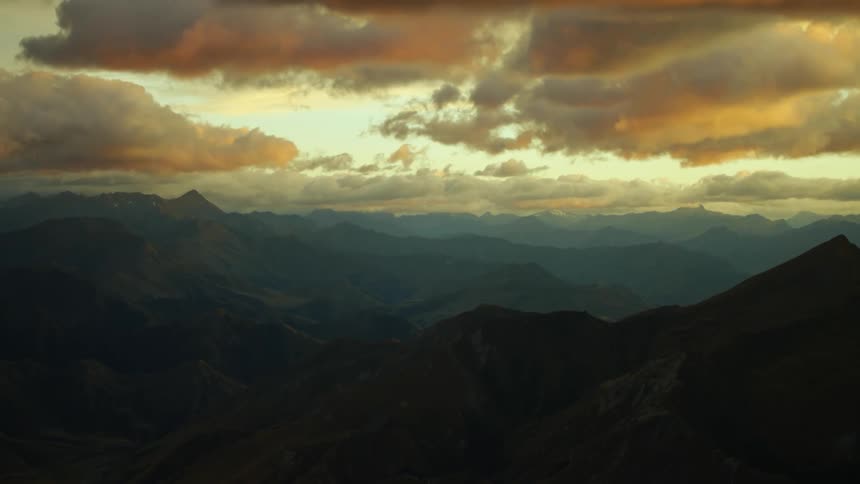 Aerial view of mountains while the sun is setting