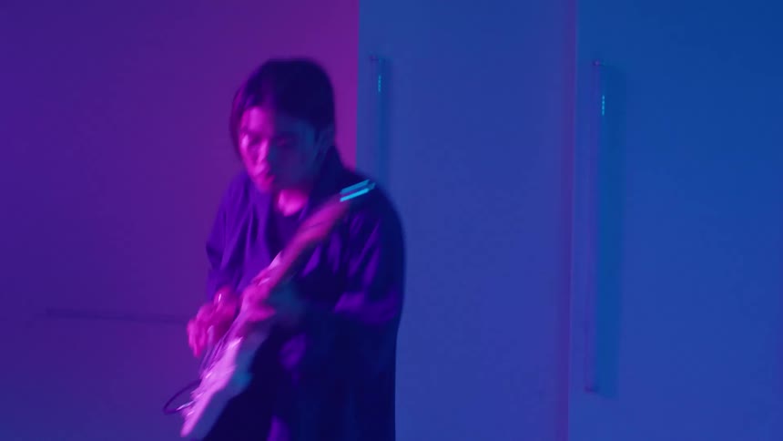 There is a band that is playing together inside of a night club