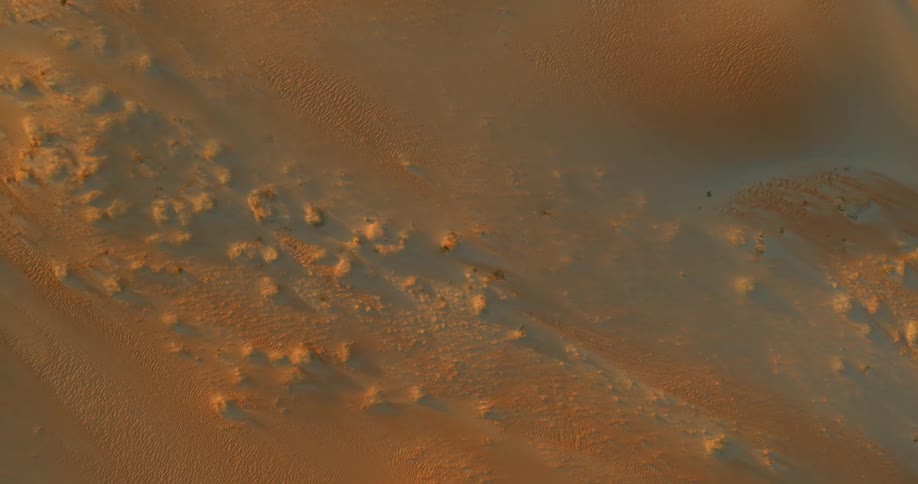 Aerial view of desert land at dusk