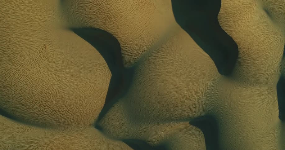 Top down aerial view of sand dunes in the desert