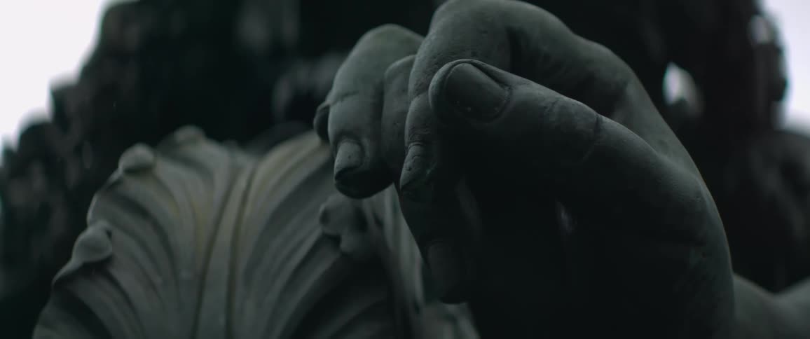 The hand of a statue is reaching