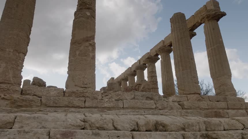 Ancient ruins on a partly cloudy day