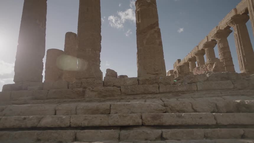 Stone steps lead to pillars above