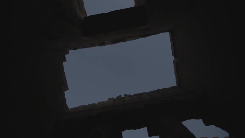 A stone building at dusk