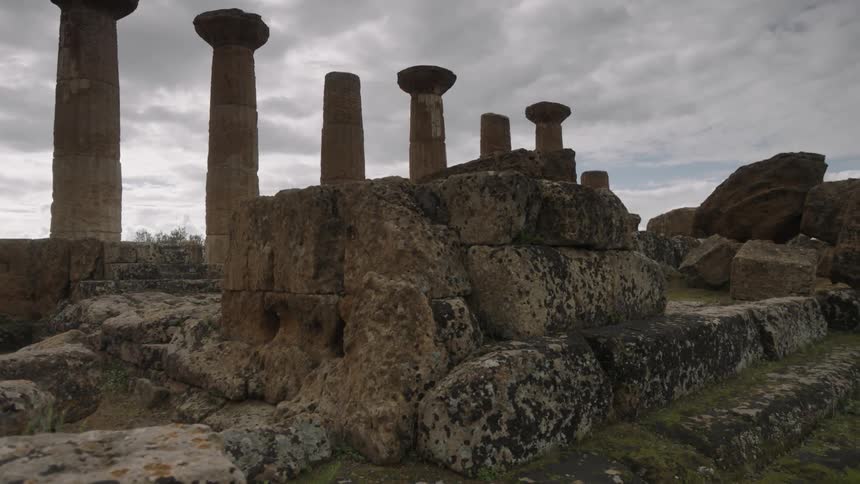 Stone pillars and ancient ruins on a cloudy day