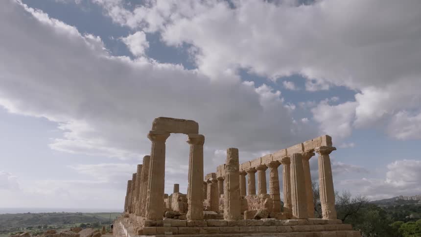 Stone pillars are on a platform on a cloudy day