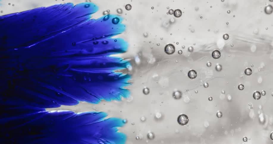 The bubbles flow toward the blue gel