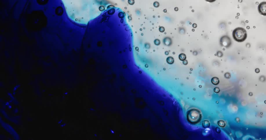 Bubble spheres float across a blue and white organic environment