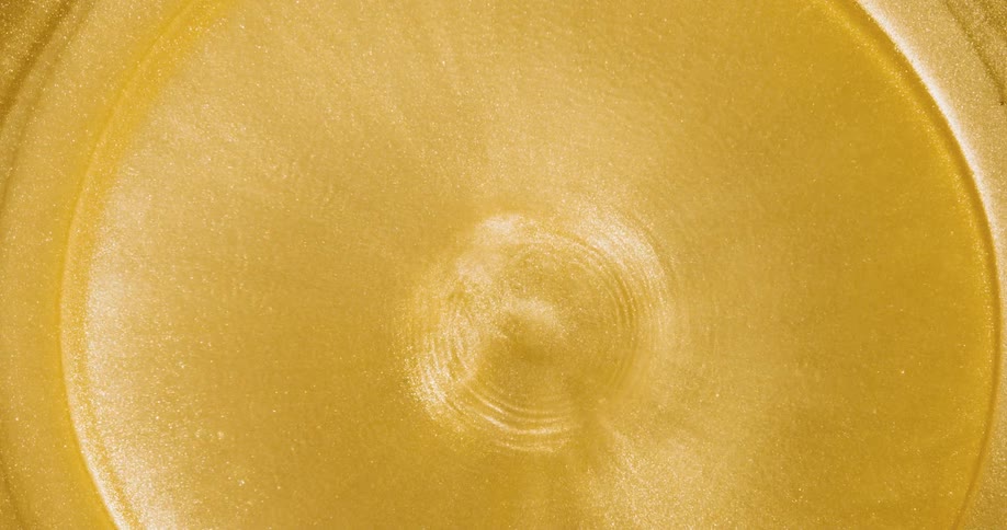 Abstract footage of gold liquid moving