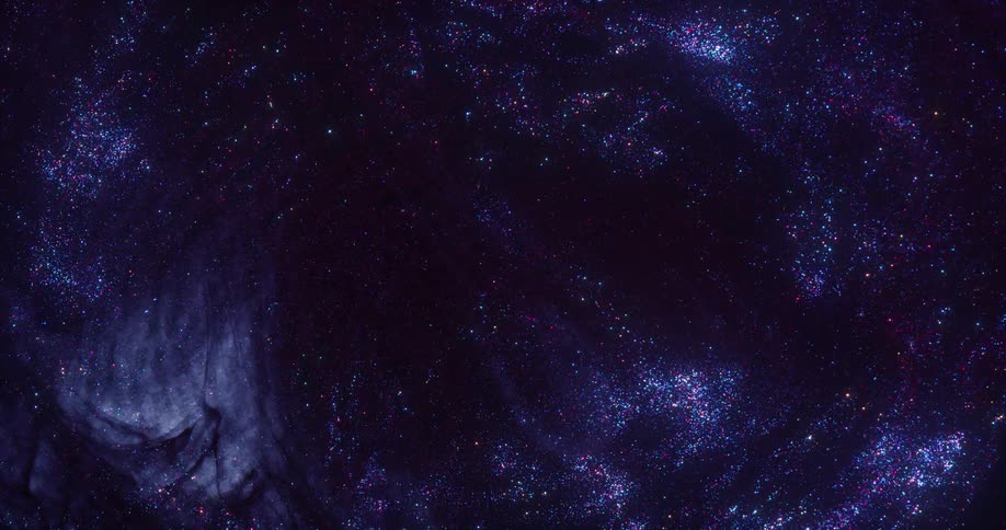 Glittering particles in various shades flow in blue and black mixture