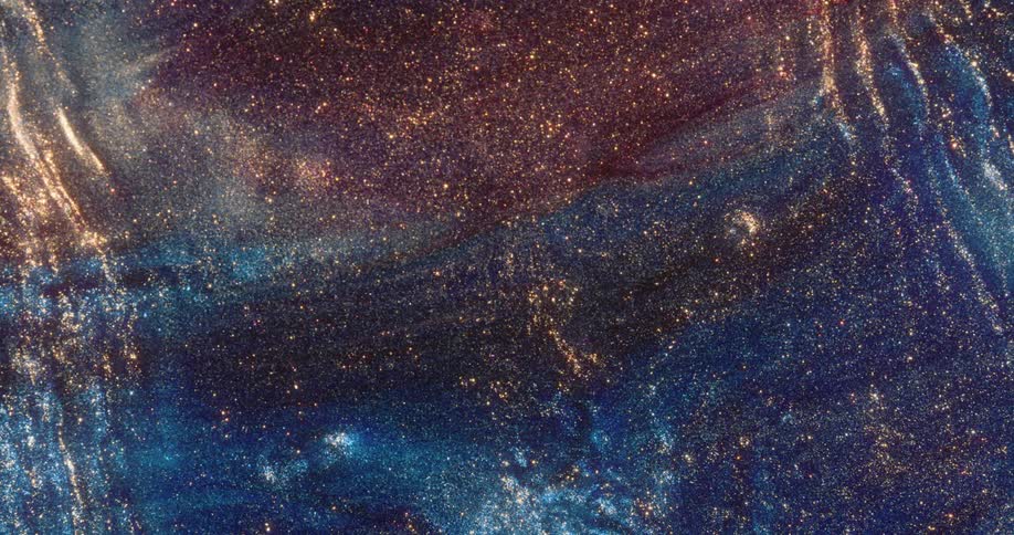 Shimmering colorful grains flow and expand outward