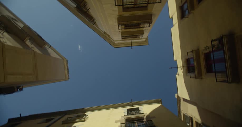 Looking up at old town buildings
