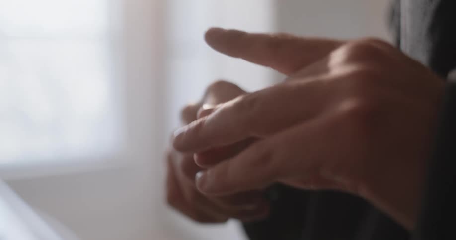 A man puts a bandage on his finger