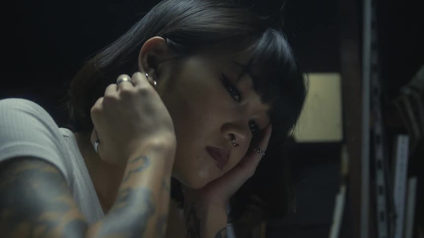 A young asian woman sitting at desk
