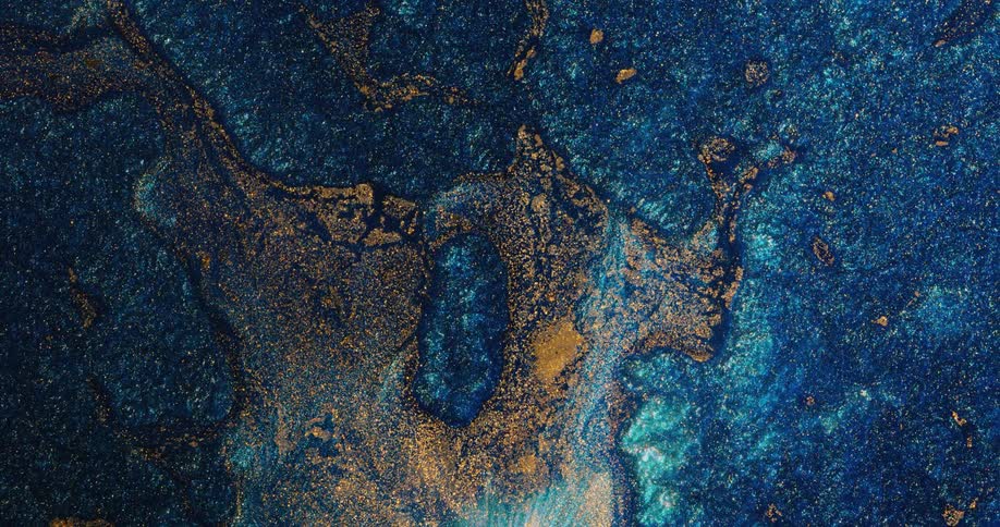 A mass floating atop blue shimmering liquid