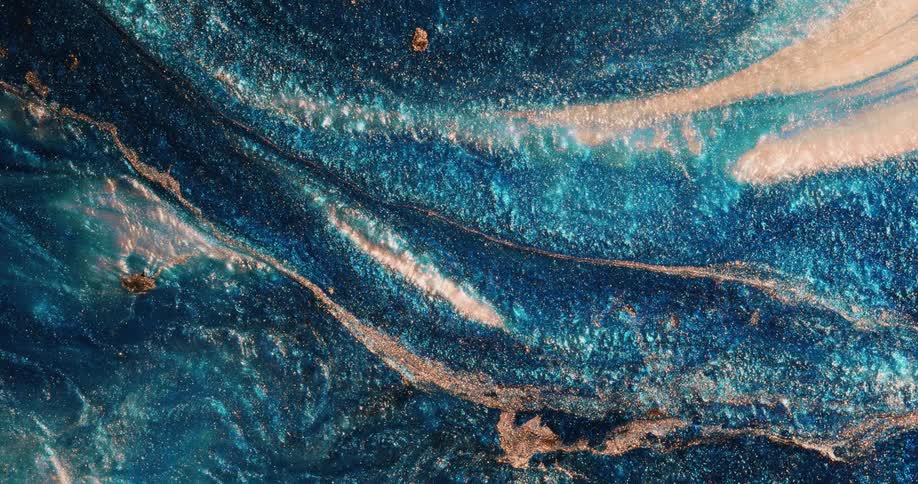 A colorful shimmering surface expands in a wave then bursts