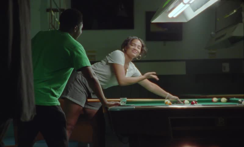 There are friends that are playing pool against each other