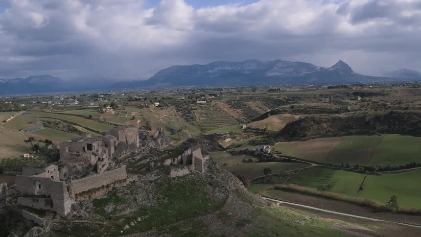 A stone city on a hill on a cloudy day