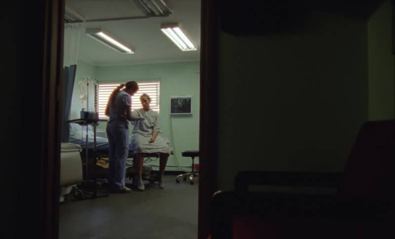 A nurse is checking on a patient