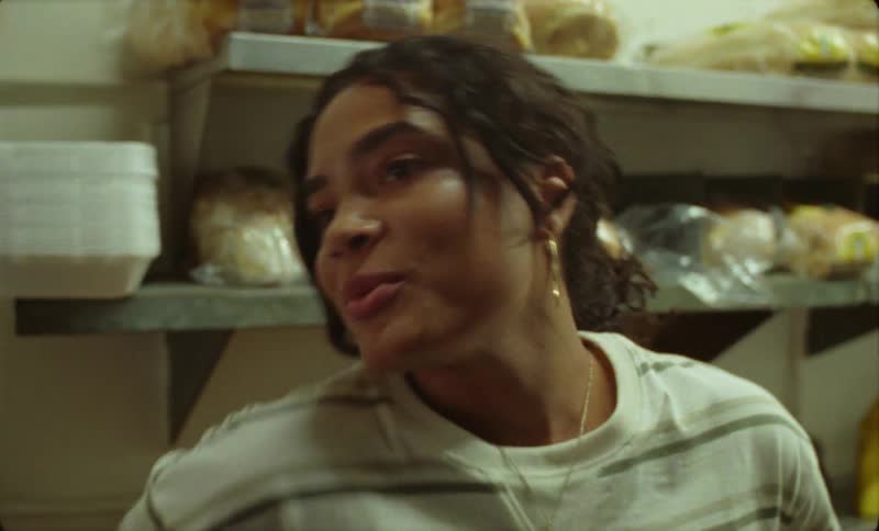 A woman walks to the counter in the restaurant