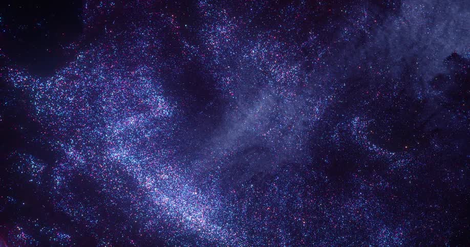 Bright sparkling shiny specks of glitter floating in dark blue ink forming concentric shapes
