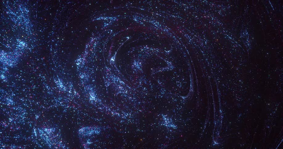 Bright sparkling shiny specks of glitter floating in dark blue ink forming concentric shapes