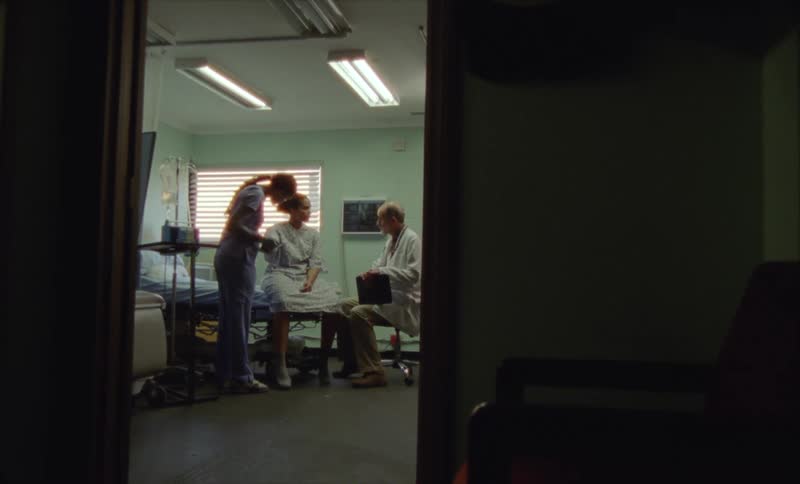 A patient is seeing a doctor and is in there room getting checked out