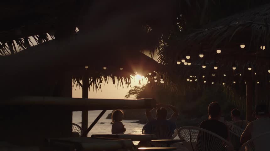 People are walking around the beach resort