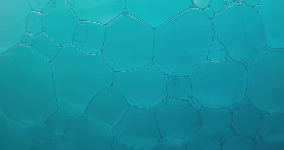 Polygon and hexagon bubble shapes are forming in a liquid substance