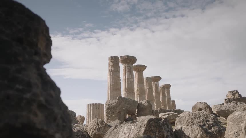 Large stone columns stand among the boulders