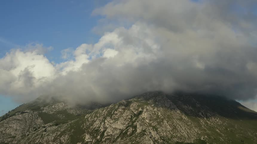 Clouds surround a peak in the Cantabrian mountain range