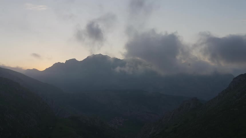 Clouds are floating low over mountain tops in Northern Spain