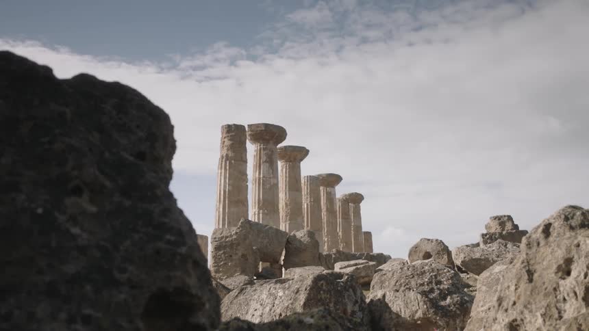 A large multi column monument in the daytime