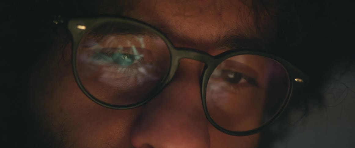 There is a close up of a man with glasses on