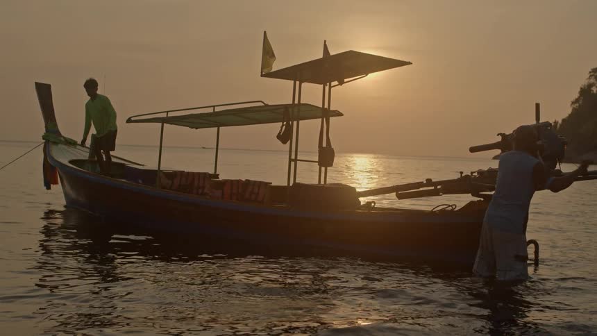 Two Thai Fisherman prepare to go to sea