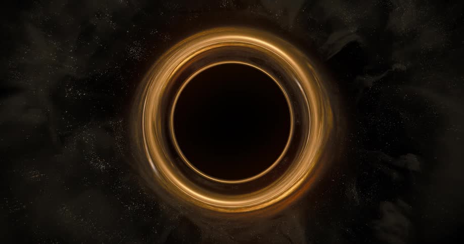 An orange circle turns as it glows and blends into the darkness