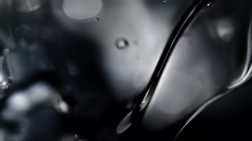 Bubble spheres are floating in a liquid as they reflect light