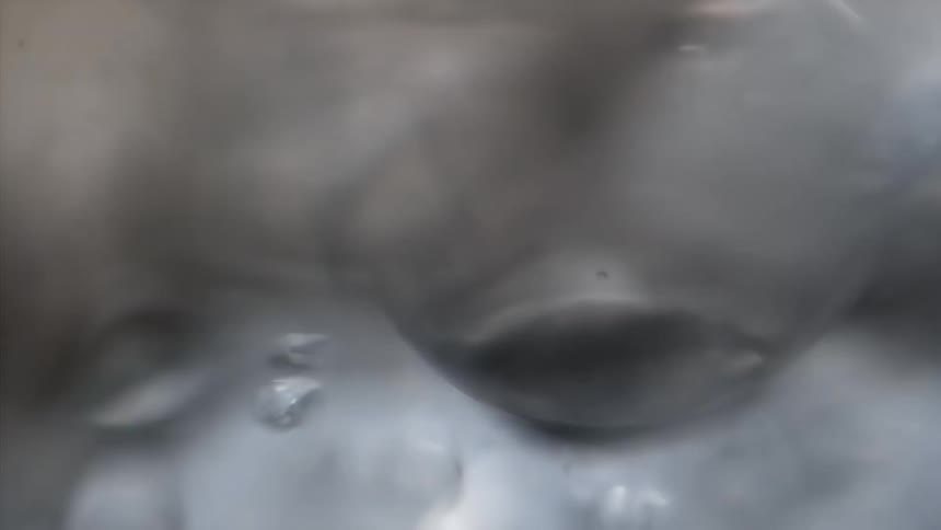 Flowing droplets of clear liquid