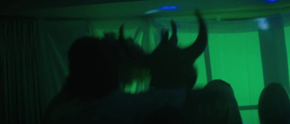 People are dancing at a costume party