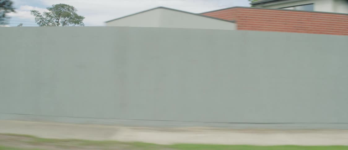 Houses in a neighborhood all have fences around them