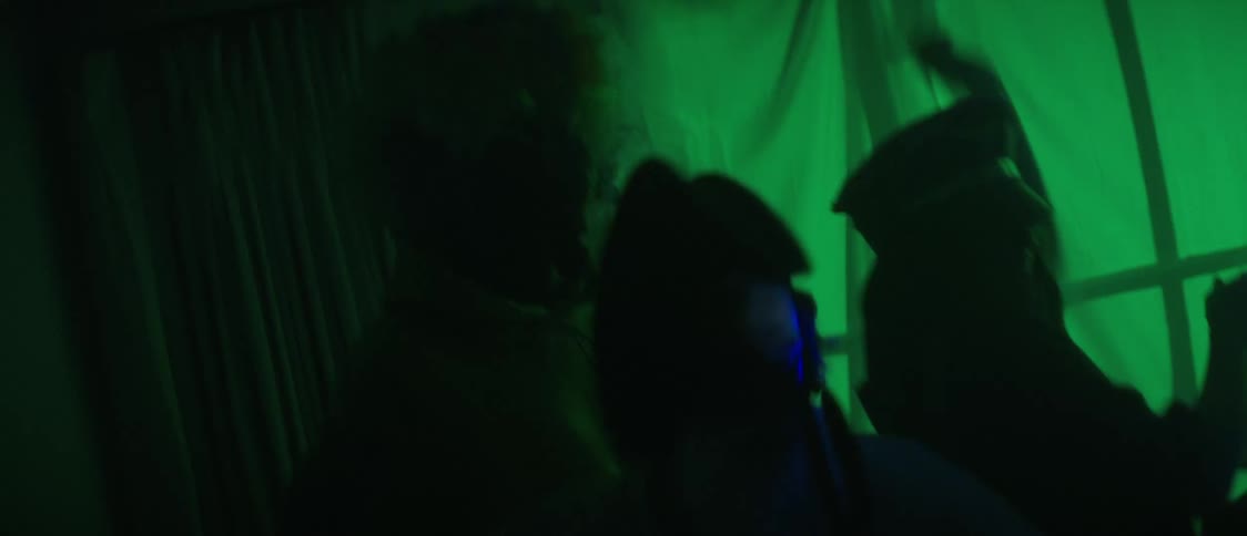 Silhouette of a group of friends dancing on a costume party